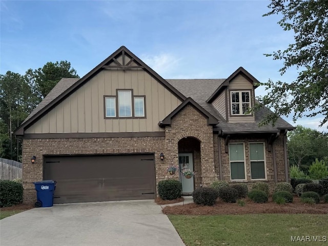 178 Natures Trl, Wetumpka, AL 36093 - craftsman house featuring driveway, roof with shingles, brick siding, an attached garage, and board and batten siding