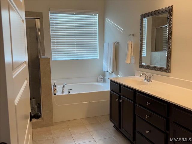 178 Natures Trl, Wetumpka, AL 36093 - bathroom featuring a bath, vanity, an enclosed shower, and tile patterned flooring