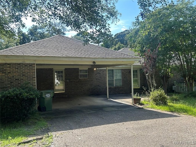 2 Rolling Hills Cir, Camden, AL 36726 - view of property exterior with a shingled roof, brick siding, and driveway