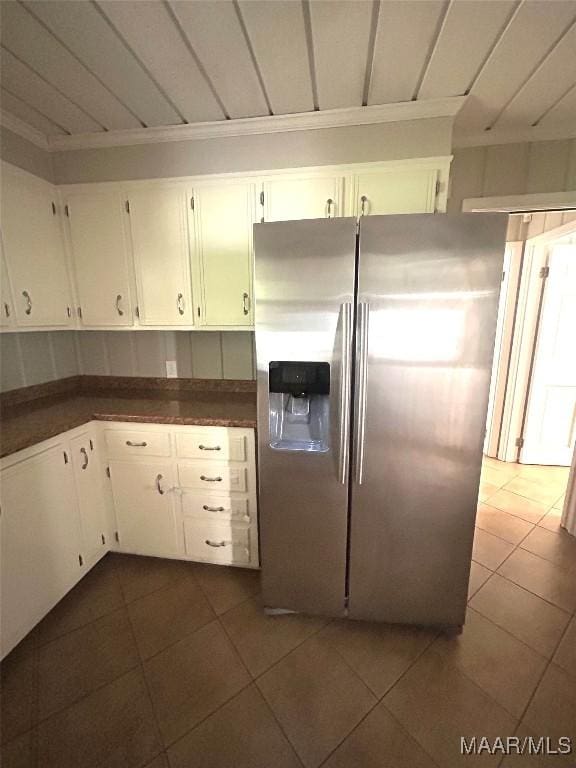 2 Rolling Hills Cir, Camden, AL 36726 - kitchen with stainless steel fridge with ice dispenser, dark tile patterned floors, dark countertops, and white cabinets