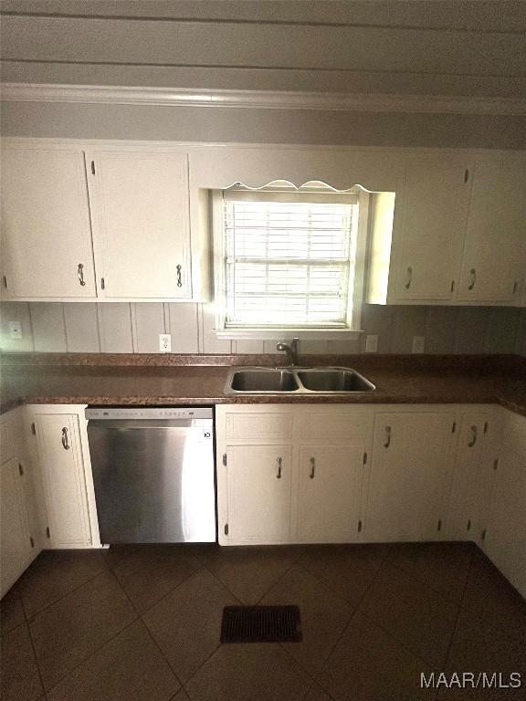 2 Rolling Hills Cir, Camden, AL 36726 - kitchen with dishwasher, white cabinets, dark tile patterned flooring, and crown molding