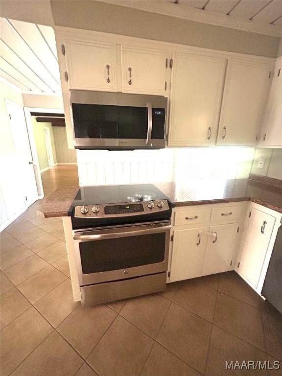 2 Rolling Hills Cir, Camden, AL 36726 - kitchen featuring stainless steel appliances, tile patterned floors, and white cabinets