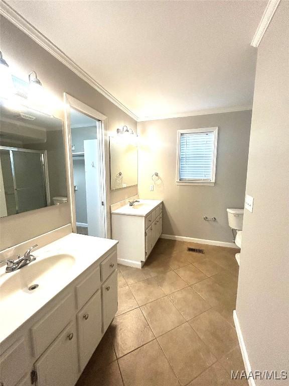 2 Rolling Hills Cir, Camden, AL 36726 - bathroom featuring crown molding, two vanities, a stall shower, and tile patterned floors