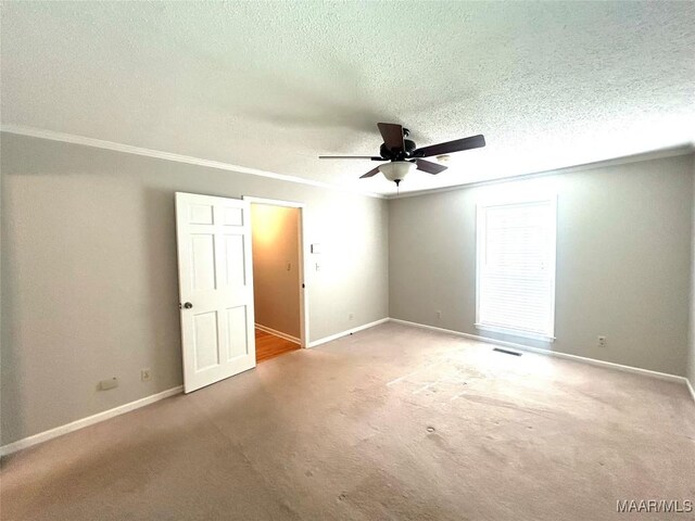 2 Rolling Hills Cir, Camden, AL 36726 - unfurnished room with ceiling fan, ornamental molding, carpet, and a textured ceiling