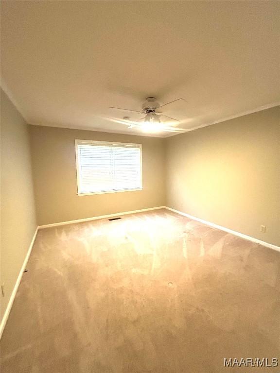 2 Rolling Hills Cir, Camden, AL 36726 - spare room featuring carpet flooring and a ceiling fan
