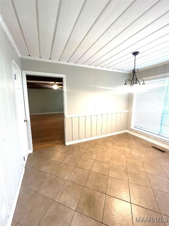 2 Rolling Hills Cir, Camden, AL 36726 - empty room with a chandelier and tile patterned floors