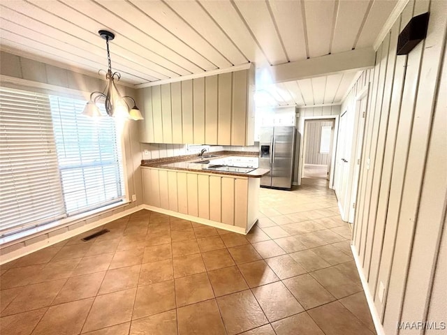 2 Rolling Hills Cir, Camden, AL 36726 - kitchen featuring stainless steel refrigerator with ice dispenser, a peninsula, tile patterned flooring, a chandelier, and hanging light fixtures