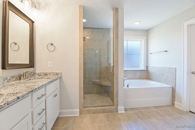 97 Abbington Blvd, Pike Road, AL 36064 - full bathroom with vanity, a stall shower, a bath, and tile patterned floors
