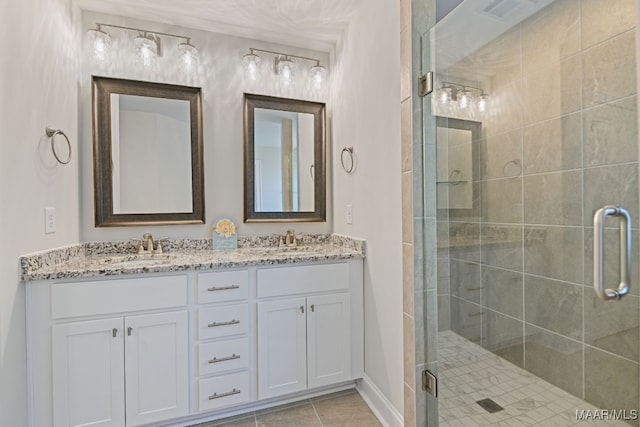97 Abbington Blvd, Pike Road, AL 36064 - bathroom with double vanity, a stall shower, and tile patterned flooring