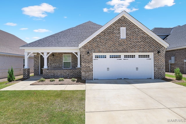 97 Abbington Blvd, Pike Road, AL 36064 - view of front facade with brick siding, an attached garage, concrete driveway, a shingled roof, and a front yard