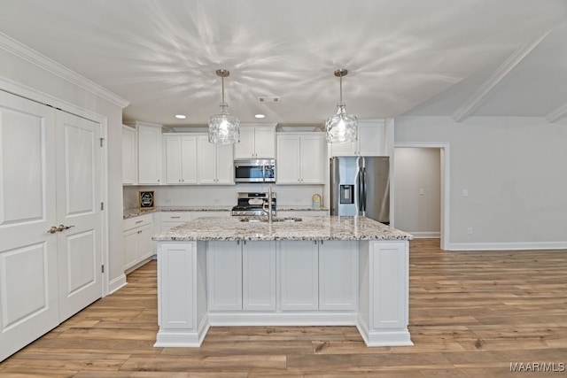 97 Abbington Blvd, Pike Road, AL 36064 - kitchen with stainless steel appliances, light wood finished floors, white cabinetry, a kitchen island with sink, and crown molding