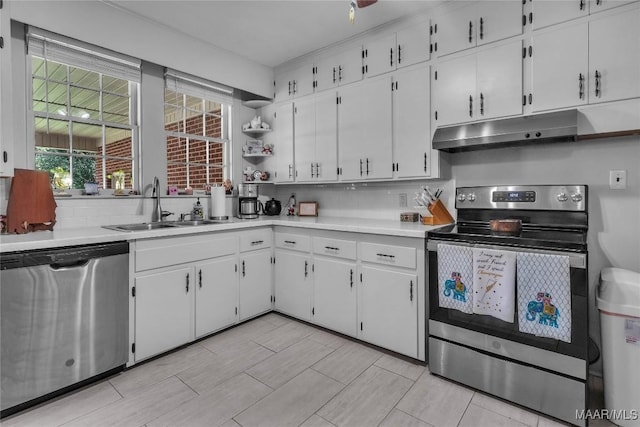 17 Calhoun Rd, Montgomery, AL 36109 - kitchen with appliances with stainless steel finishes, under cabinet range hood, light countertops, and white cabinets