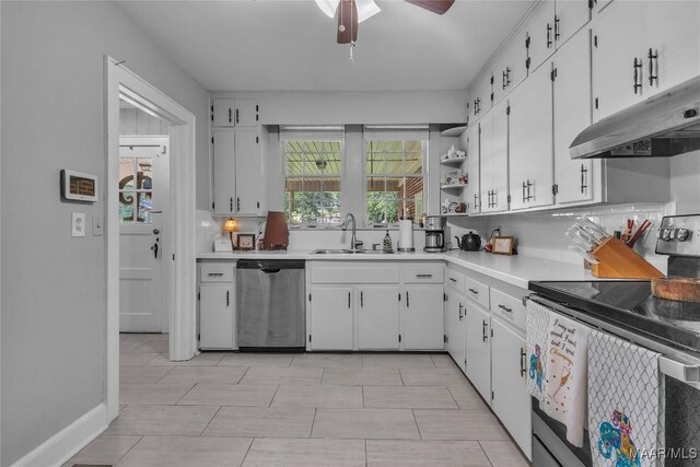 17 Calhoun Rd, Montgomery, AL 36109 - kitchen featuring appliances with stainless steel finishes, under cabinet range hood, white cabinetry, light countertops, and ceiling fan