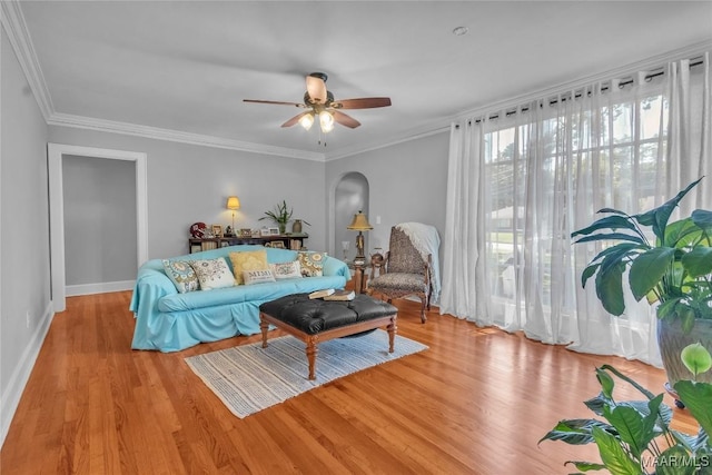 17 Calhoun Rd, Montgomery, AL 36109 - living area with light wood finished floors, arched walkways, ceiling fan, and crown molding