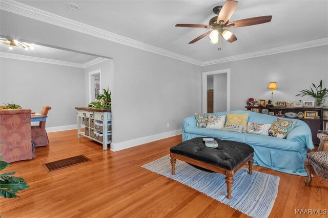 17 Calhoun Rd, Montgomery, AL 36109 - living room with ceiling fan, wood finished floors, and ornamental molding