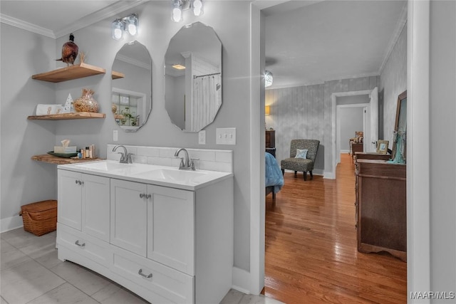 17 Calhoun Rd, Montgomery, AL 36109 - bathroom featuring ornamental molding, double vanity, and wood finished floors