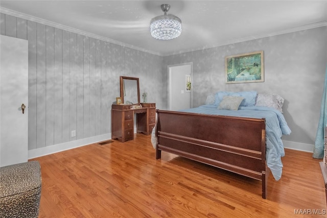 17 Calhoun Rd, Montgomery, AL 36109 - bedroom with a chandelier, wood finished floors, and ornamental molding