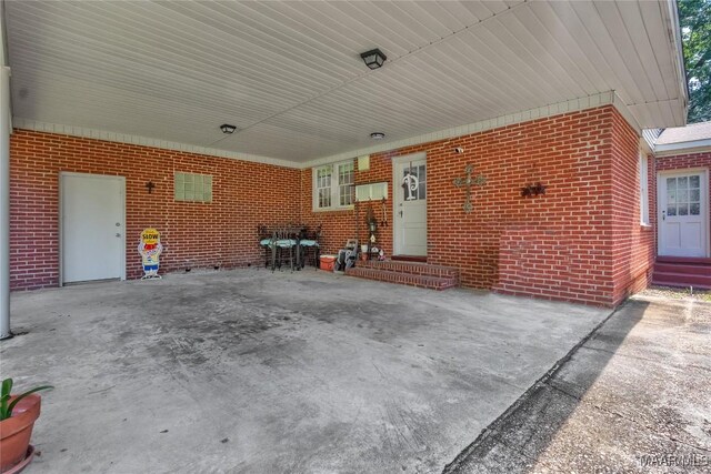 17 Calhoun Rd, Montgomery, AL 36109 - view of patio / terrace featuring a carport and entry steps
