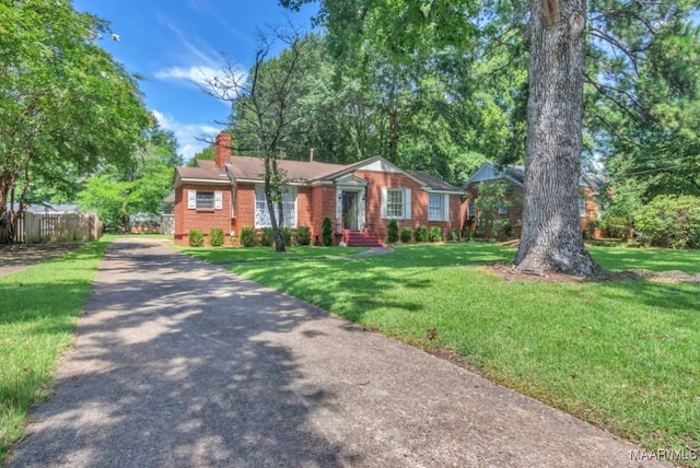 17 Calhoun Rd, Montgomery, AL 36109 - ranch-style home featuring brick siding, a chimney, and asphalt driveway