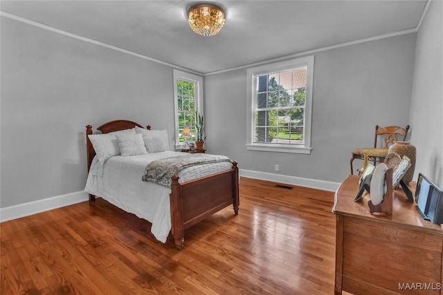17 Calhoun Rd, Montgomery, AL 36109 - bedroom with crown molding and wood finished floors