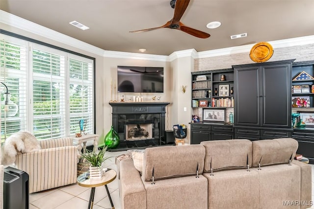 8712 Old Marsh Way, Montgomery, AL 36117 - living room with a fireplace, ceiling fan, tile patterned floors, and crown molding