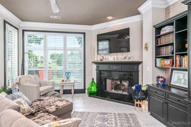8712 Old Marsh Way, Montgomery, AL 36117 - living room featuring a fireplace, light tile patterned flooring, and ornamental molding
