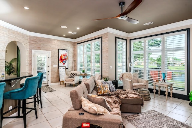 8712 Old Marsh Way, Montgomery, AL 36117 - living area with light tile patterned floors, a ceiling fan, crown molding, arched walkways, and recessed lighting