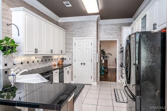 8712 Old Marsh Way, Montgomery, AL 36117 - kitchen with freestanding refrigerator, light tile patterned floors, white cabinetry, ornamental molding, and tasteful backsplash