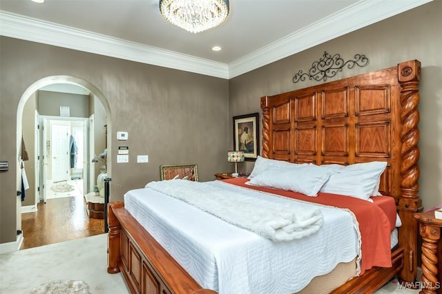 8712 Old Marsh Way, Montgomery, AL 36117 - bedroom with arched walkways, crown molding, wood finished floors, a chandelier, and recessed lighting