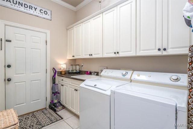 8712 Old Marsh Way, Montgomery, AL 36117 - washroom with cabinet space, crown molding, washing machine and clothes dryer, and light tile patterned floors