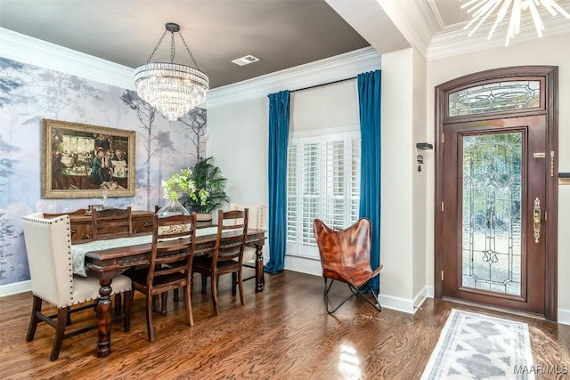 8712 Old Marsh Way, Montgomery, AL 36117 - dining space with a chandelier, healthy amount of natural light, crown molding, wood finished floors, and an accent wall