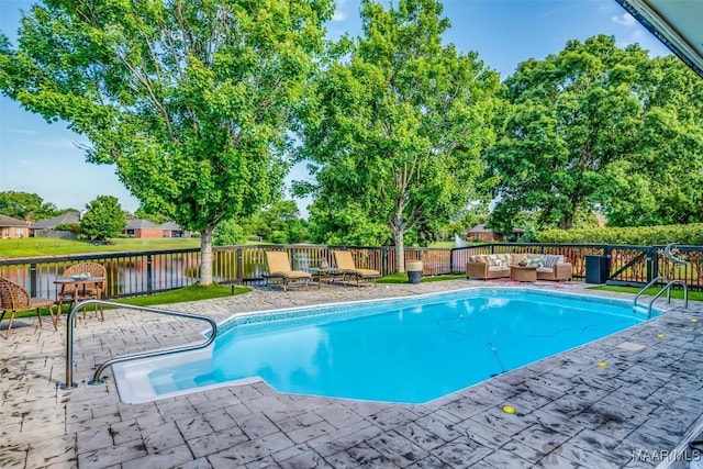 8712 Old Marsh Way, Montgomery, AL 36117 - view of pool with outdoor lounge area, a fenced backyard, a patio, and a water view