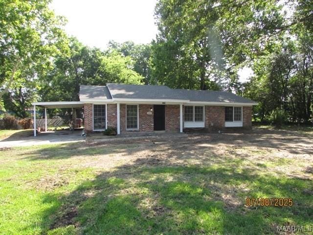 4225 Sunshine Dr, Montgomery, AL 36116 - single story home featuring an attached carport, a front lawn, and brick siding