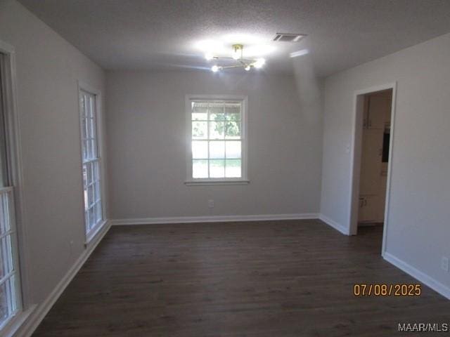 4225 Sunshine Dr, Montgomery, AL 36116 - unfurnished room featuring wood finished floors and a chandelier