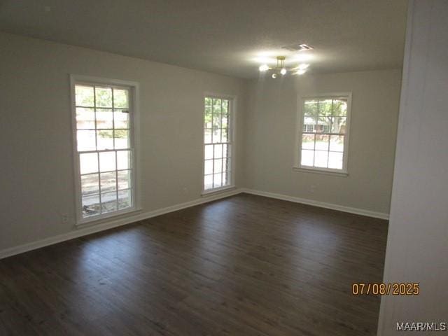 4225 Sunshine Dr, Montgomery, AL 36116 - spare room with dark wood-type flooring and a chandelier