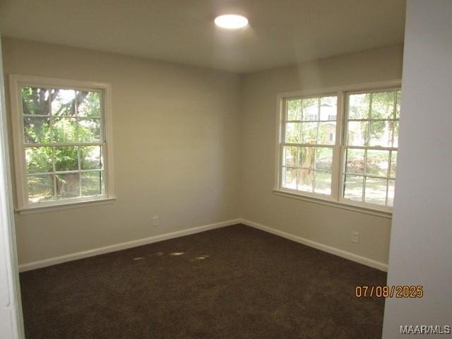 4225 Sunshine Dr, Montgomery, AL 36116 - unfurnished room featuring baseboards and dark carpet