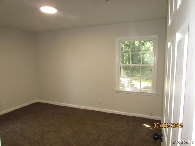 4225 Sunshine Dr, Montgomery, AL 36116 - empty room featuring dark colored carpet and baseboards
