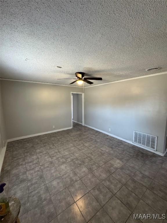 3902 Wesley Dr, Montgomery, AL 36111 - empty room with a ceiling fan and a textured ceiling