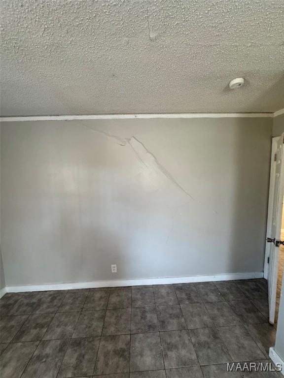 3902 Wesley Dr, Montgomery, AL 36111 - spare room with ornamental molding, a smoke detector, and a textured ceiling