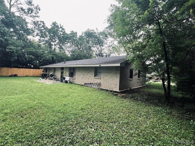 3902 Wesley Dr, Montgomery, AL 36111 - rear view of house featuring brick siding and view of scattered trees