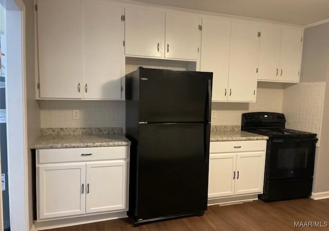 123 Hobbie Dr, Montgomery, AL 36105 - kitchen with black appliances, dark wood finished floors, light countertops, white cabinets, and tasteful backsplash