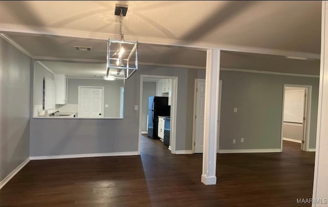 123 Hobbie Dr, Montgomery, AL 36105 - unfurnished dining area with a chandelier, dark wood-style floors, and ornamental molding