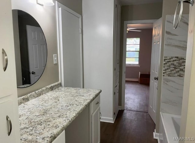123 Hobbie Dr, Montgomery, AL 36105 - full bath with vanity, wood finished floors, and a ceiling fan
