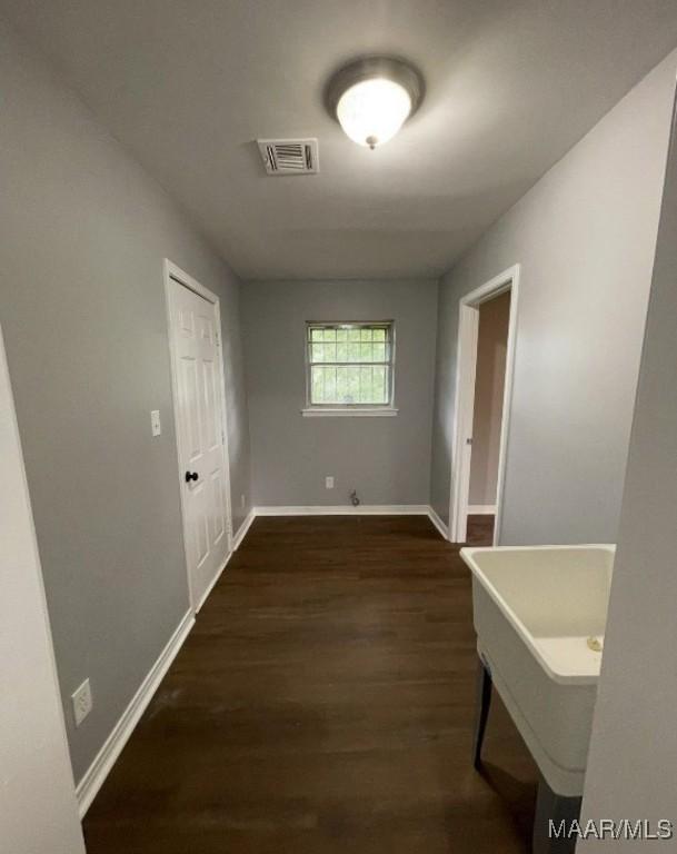 123 Hobbie Dr, Montgomery, AL 36105 - corridor featuring dark wood-style flooring and baseboards