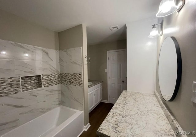 123 Hobbie Dr, Montgomery, AL 36105 - full bath with vanity, tub / shower combination, and wood finished floors