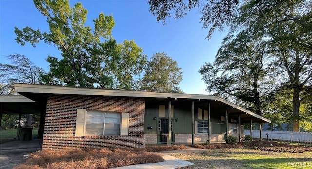 123 Hobbie Dr, Montgomery, AL 36105 - view of front facade featuring a carport and brick siding