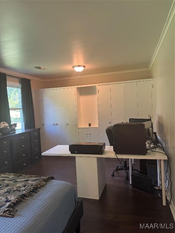 3549 Audubon Rd, Montgomery, AL 36111 - bedroom with dark wood-type flooring and crown molding
