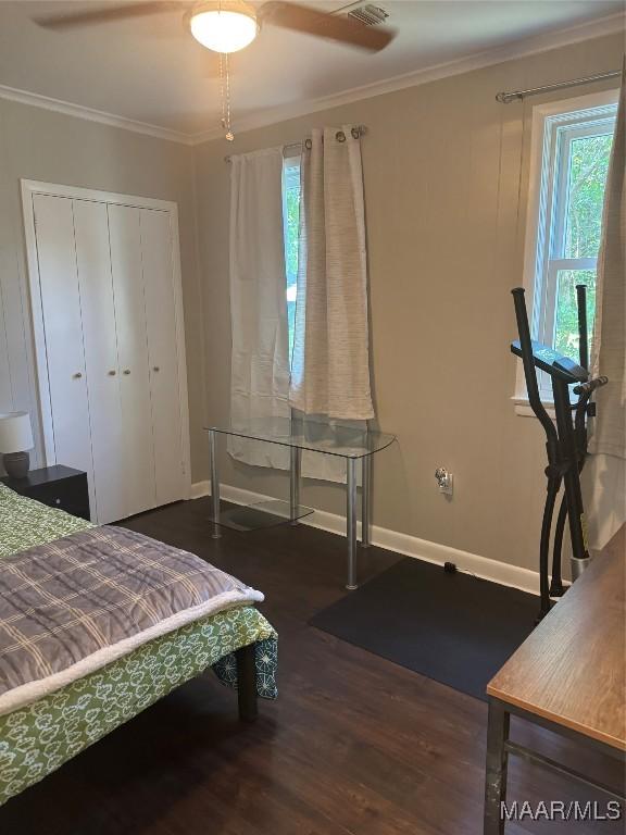 3549 Audubon Rd, Montgomery, AL 36111 - bedroom featuring wood finished floors, crown molding, ceiling fan, and a closet