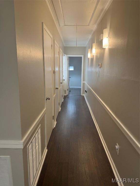 3549 Audubon Rd, Montgomery, AL 36111 - corridor featuring attic access, dark wood-type flooring, and ornamental molding