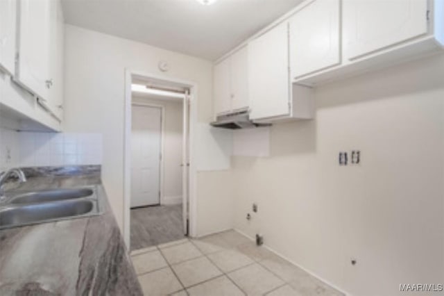 4230 Knollgate Rd, Montgomery, AL 36116 - kitchen with white cabinets, tasteful backsplash, and light tile patterned floors